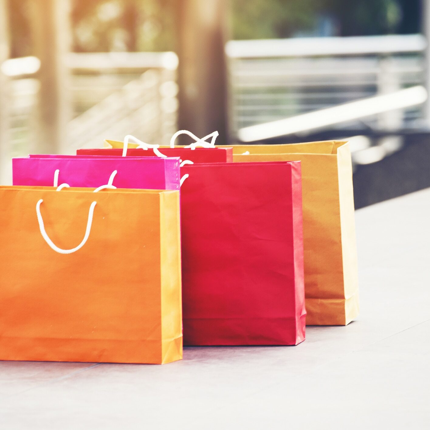 Shopping bags of women crazy shopaholic person at shopping mall. Woman love online shopping website with sales tags. E-commerce Bag Concept. Shopping bags of women crazy shopaholic person at shopping mall. Woman love online shopping website with sales tags. E-commerce Bag Concept.